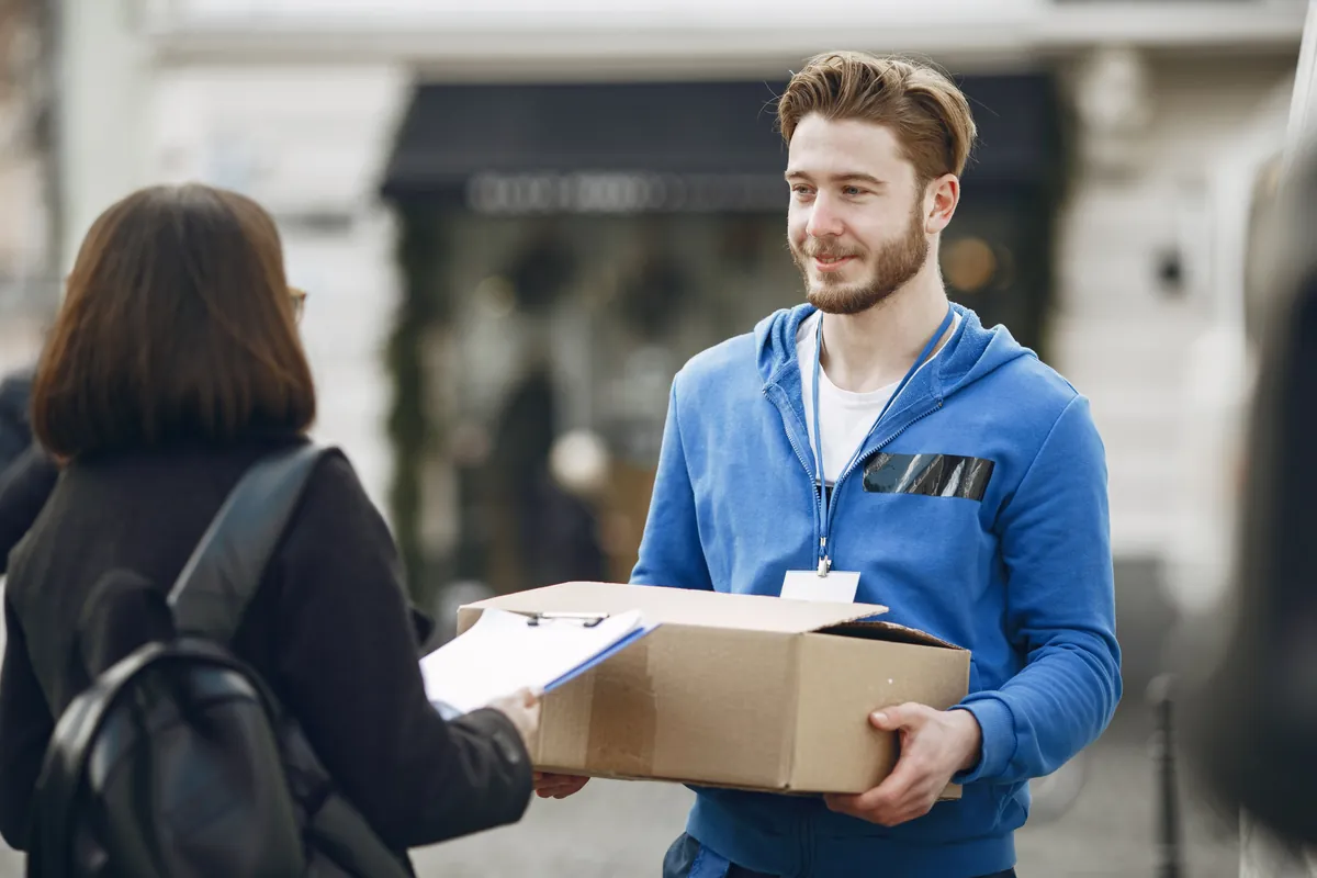 Export delivery professional handing over a shipment to a customer
